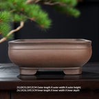 Rounded square brown bowl pot with low block feet and size labels