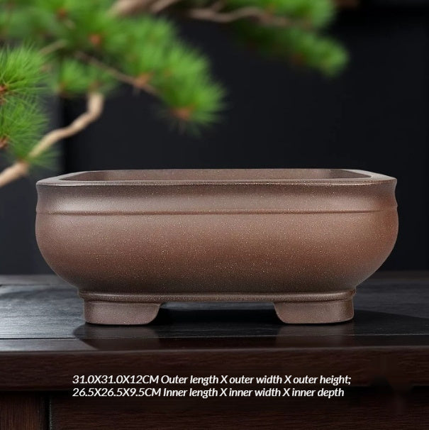 Rounded square brown bowl pot with low block feet and size labels