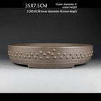 Front view of the taupe drum pot with measurement labels