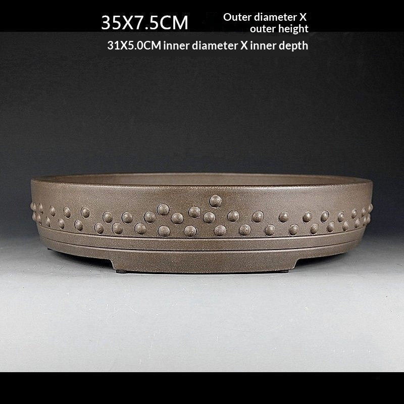 Front view of the taupe drum pot with measurement labels