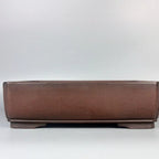 Plain reddish-brown rectangular pot with low feet and narrow lower band