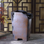 Front view of the mottled cascade pot with cutout feet