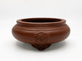 Brown round bonsai pot with rounded walls, raised circular ornament and decorative feet