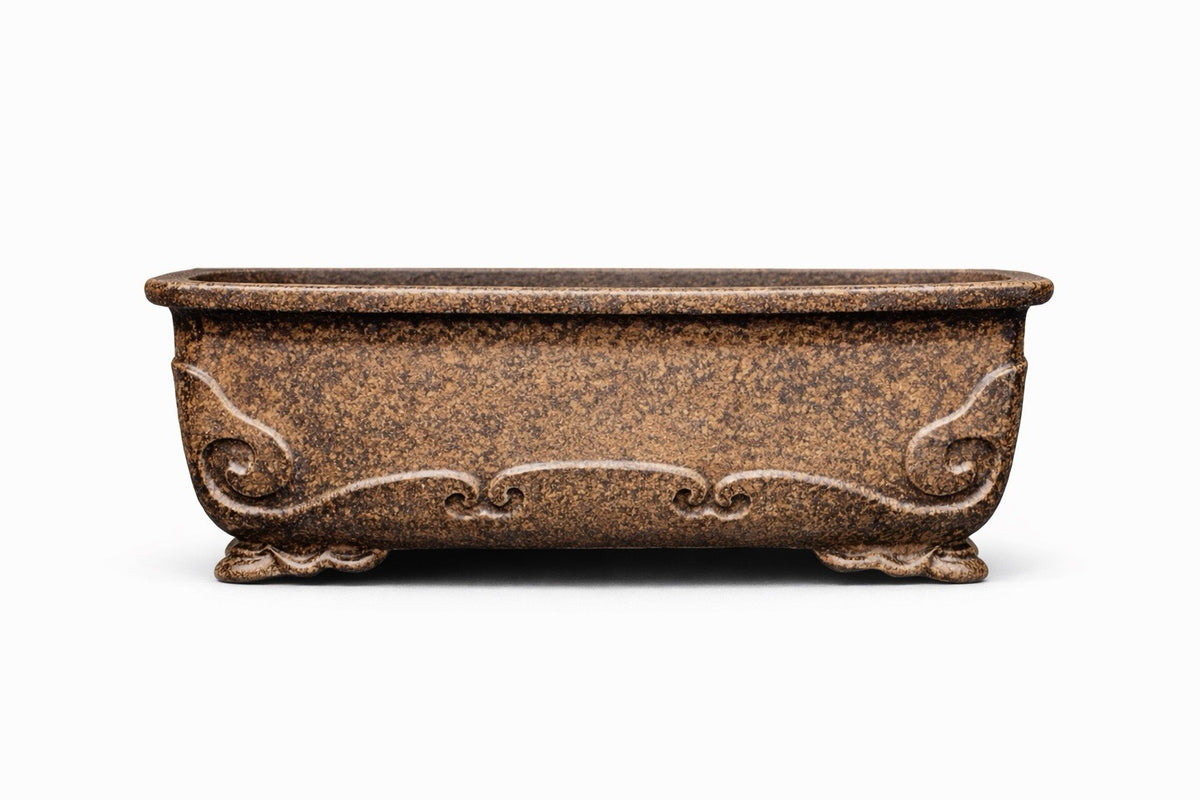 Brown rectangular bonsai pot with mottled surface, scrolling relief and decorative feet