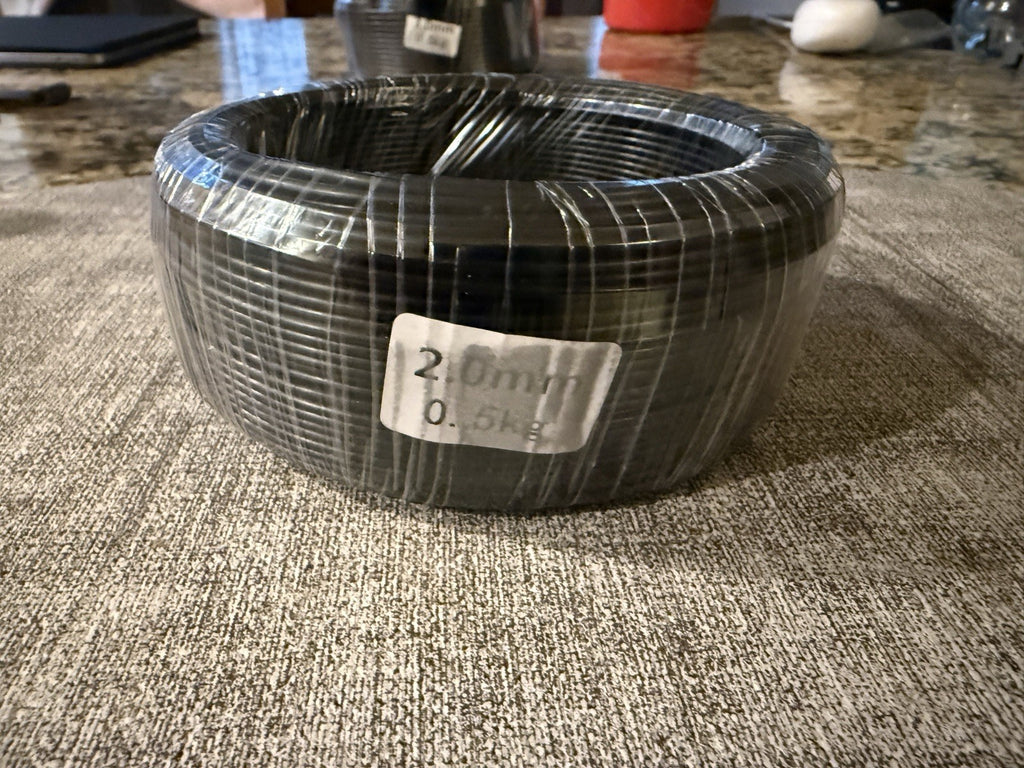 Front view of a wrapped wire coil with a visible 2.0 mm label