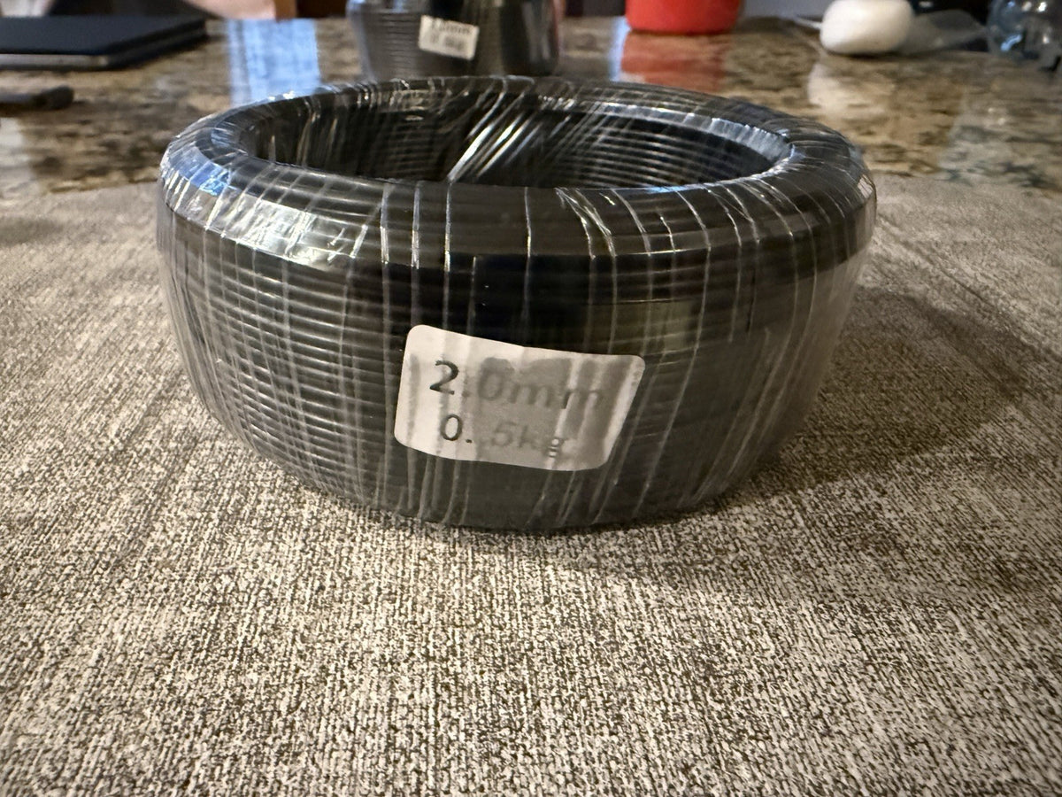 Front view of a wrapped wire coil with a visible 2.0 mm label