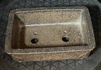 Top view inside the mottled rectangular pot showing two drainage holes and smaller openings