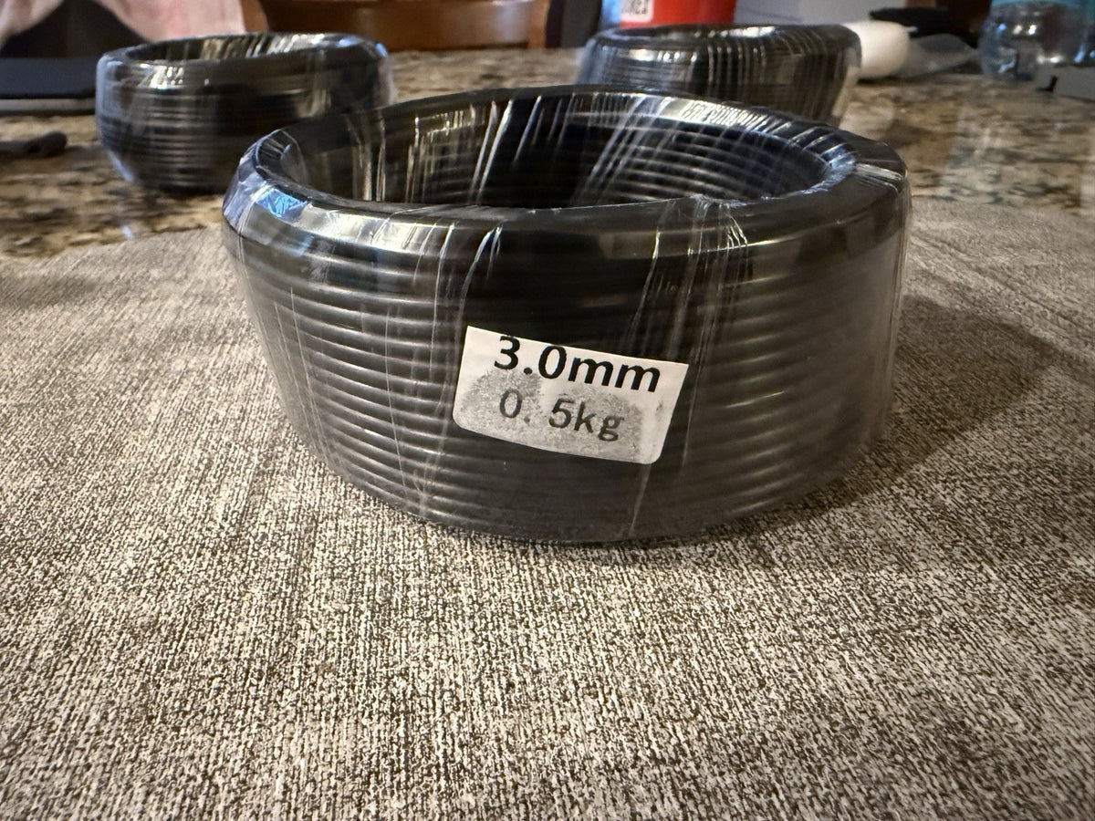 Front view of a wrapped wire coil with a visible 3.0 mm and 0.5 kg label