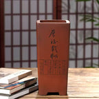 Tall reddish-brown square pot with calligraphy and rectangular seal designs