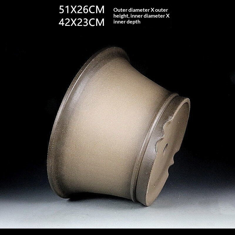 Taupe deep round pot tilted sideways with measurement labels