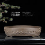 Taupe studded drum pot with exterior and interior size annotations