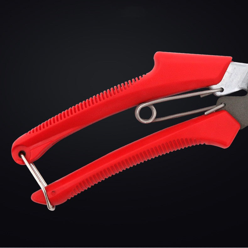 Close-up of red textured handles and wire retaining clip