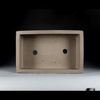 Top view of taupe rectangular pot showing two large openings and four small holes