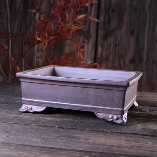 Purple-brown rectangular bonsai pot with flared rim and curled feet