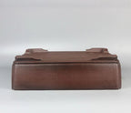 Brown rectangular pot upside down showing corner feet