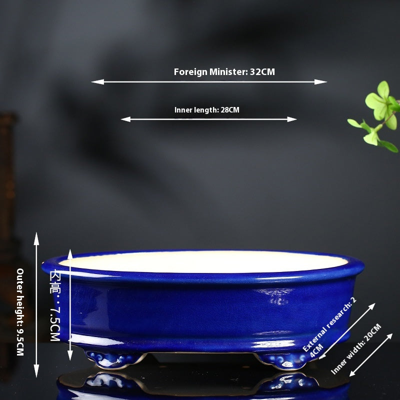 Large cobalt blue oval bonsai pot with decorative feet and exterior and interior measurement arrows
