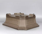 Taupe pot upside down showing raised corner feet