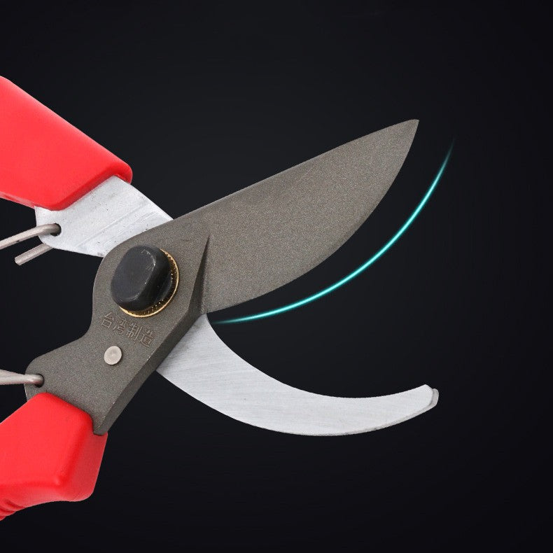 Open bypass blade detail with a curved line highlighting its cutting edge