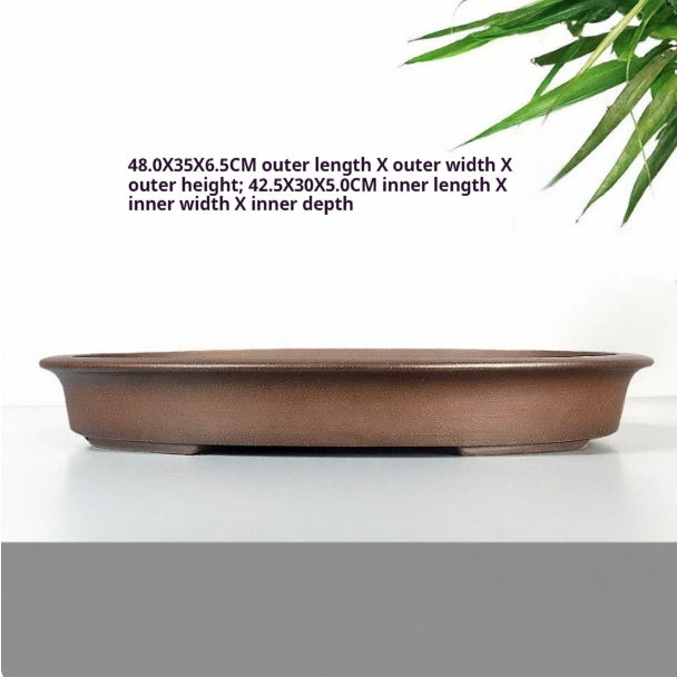 Brown oval pot with exterior and interior measurement labels