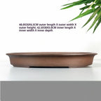 Brown oval pot with exterior and interior measurement labels