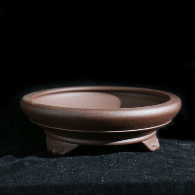 Brown round cloud-foot bonsai pot, angled view