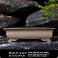 Rectangular clay bonsai pot with cloud-style feet
