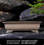 Rectangular clay bonsai pot with cloud-style feet