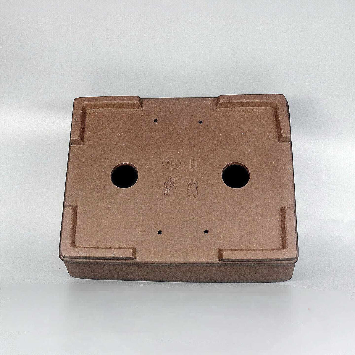 Rectangular Zisha pot underside with drainage and wiring holes