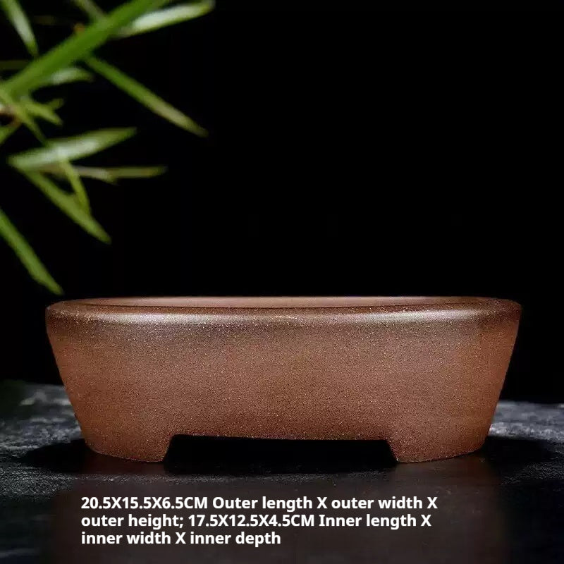Side view of the brown oval pot with dimension labels