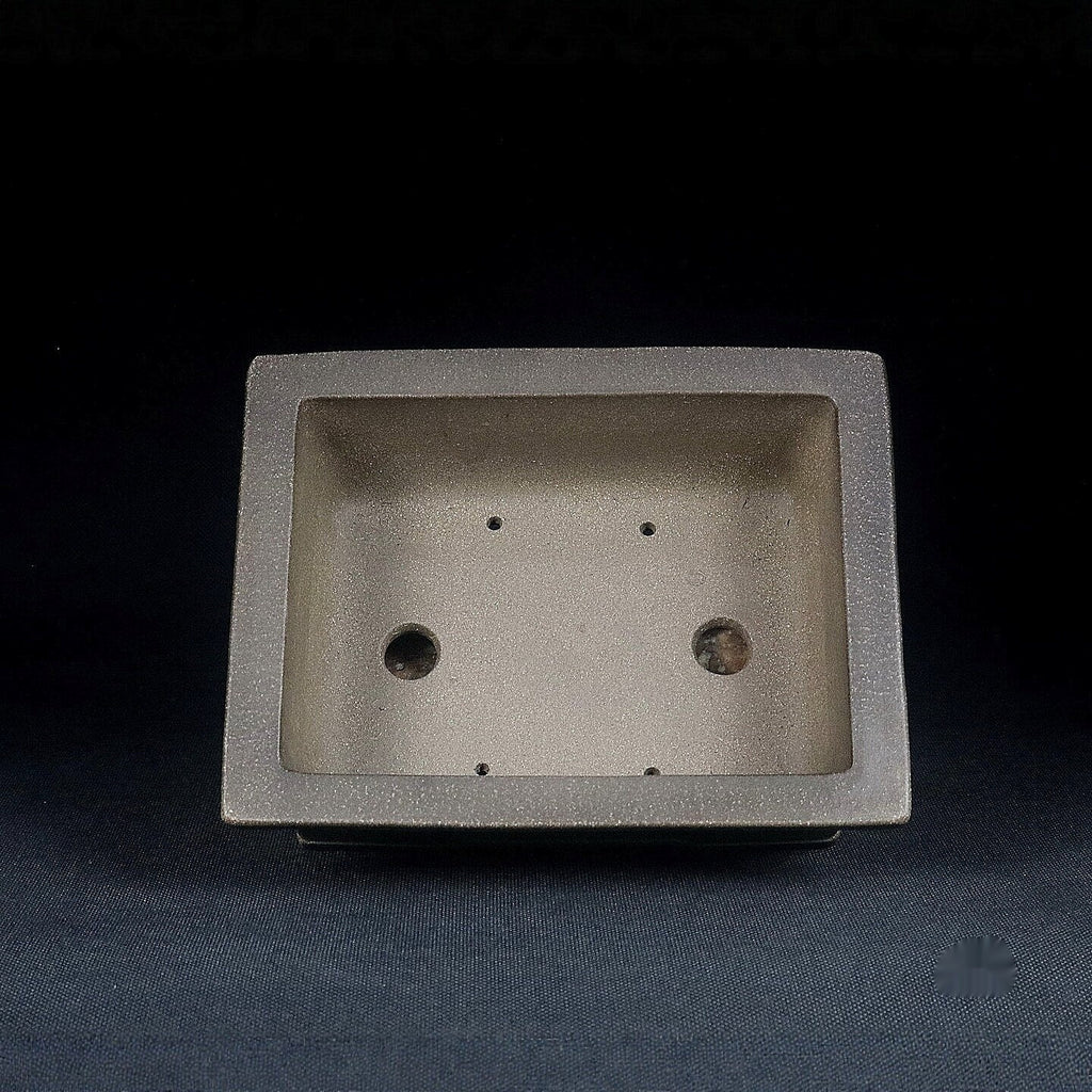 Top view of gray rectangular pot showing two large openings and smaller holes
