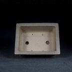 Top view of gray rectangular pot showing two large openings and smaller holes