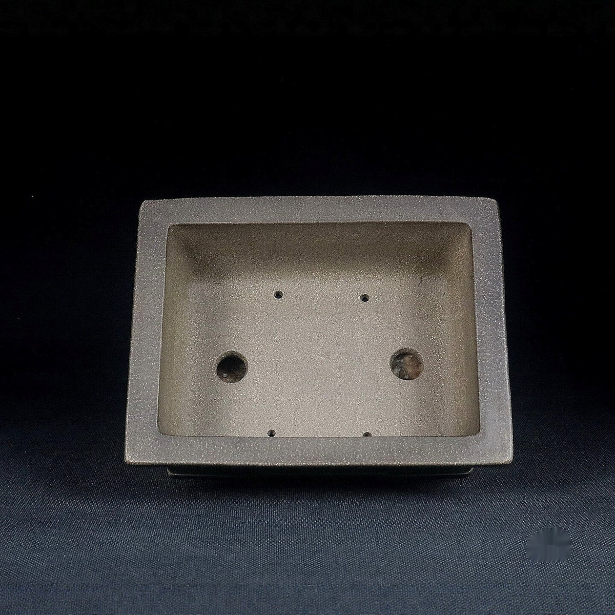 Top view of gray rectangular pot showing two large openings and smaller holes