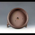 Front-facing interior view of the brown round pot