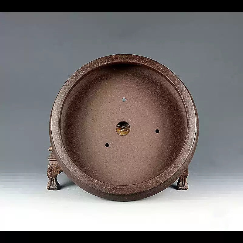Front-facing interior view of the brown round pot
