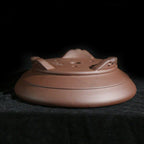 Round Zisha pot underside with drainage opening