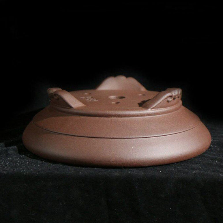 Round Zisha pot underside with drainage opening