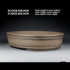 Angled taupe oval pot with exterior and interior measurement labels