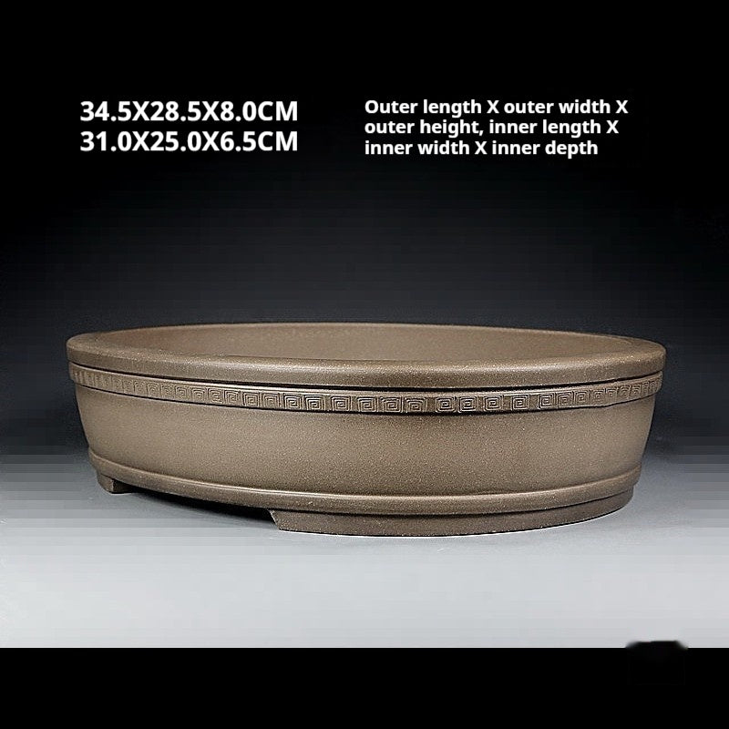 Angled taupe oval pot with exterior and interior measurement labels