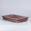 Shallow brown rectangular bonsai pot with flared rim and low feet