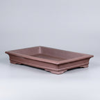 Shallow brown rectangular bonsai pot with flared rim and low feet