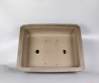 Top view of taupe rectangular pot showing two large openings and four small holes