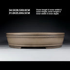 Front view of the banded taupe oval pot with size annotations