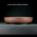 Studded reddish-brown round pot with a printed 32.5 by 7 cm size label