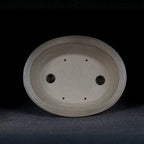 Oval Zisha pot interior with drainage and wiring holes