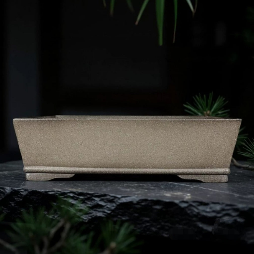 Taupe rectangular pot with straight flaring walls and low feet