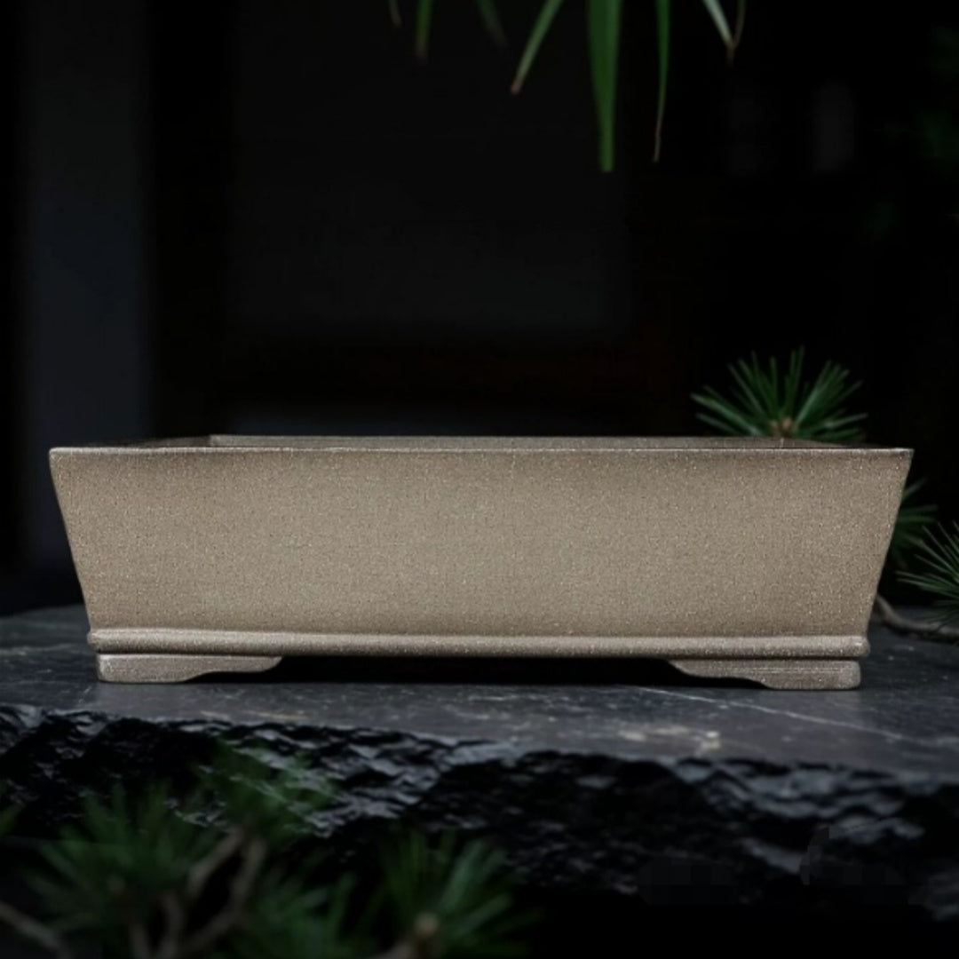 Taupe rectangular pot with straight flaring walls and low feet