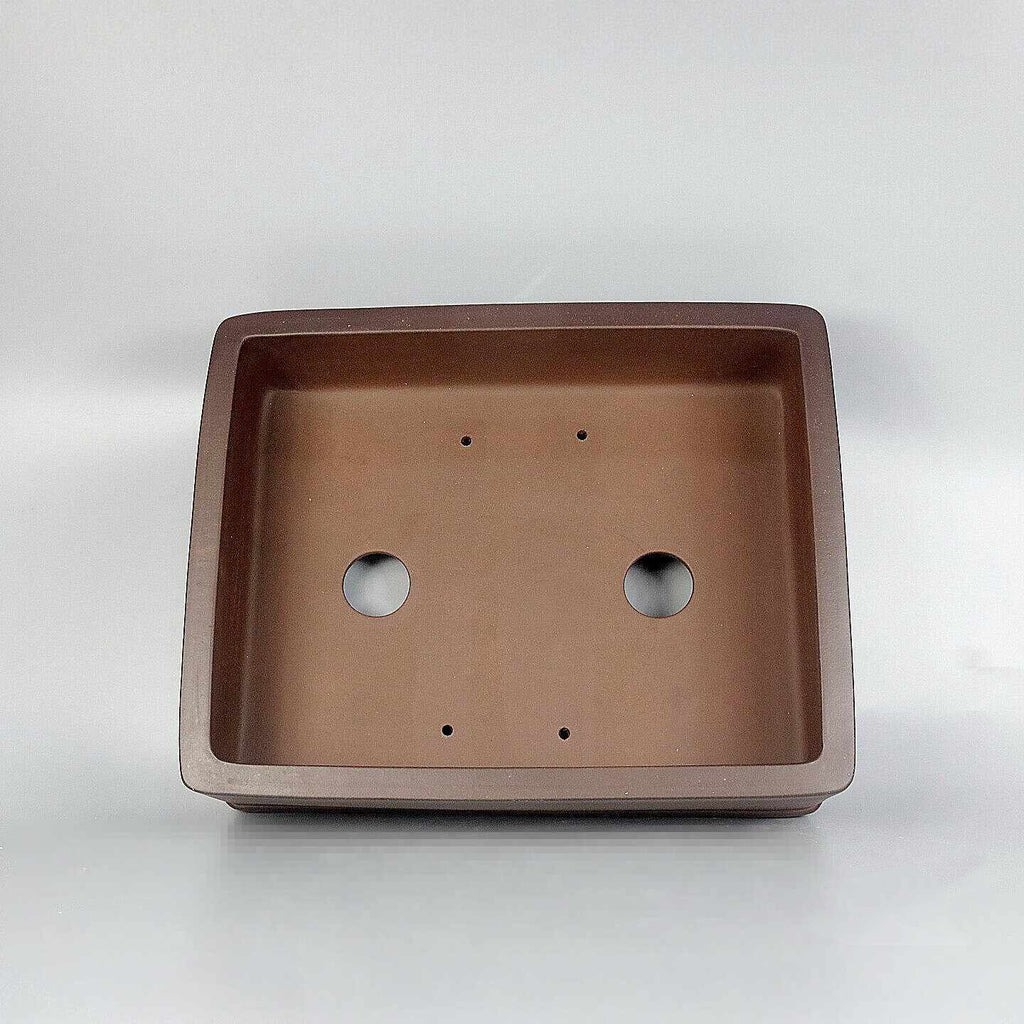 Brown rectangular Zisha pot interior with two drainage holes