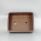 Brown rectangular Zisha pot interior with two drainage holes
