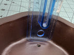 Ruler inside the basket-weave pot demonstrating its usable depth