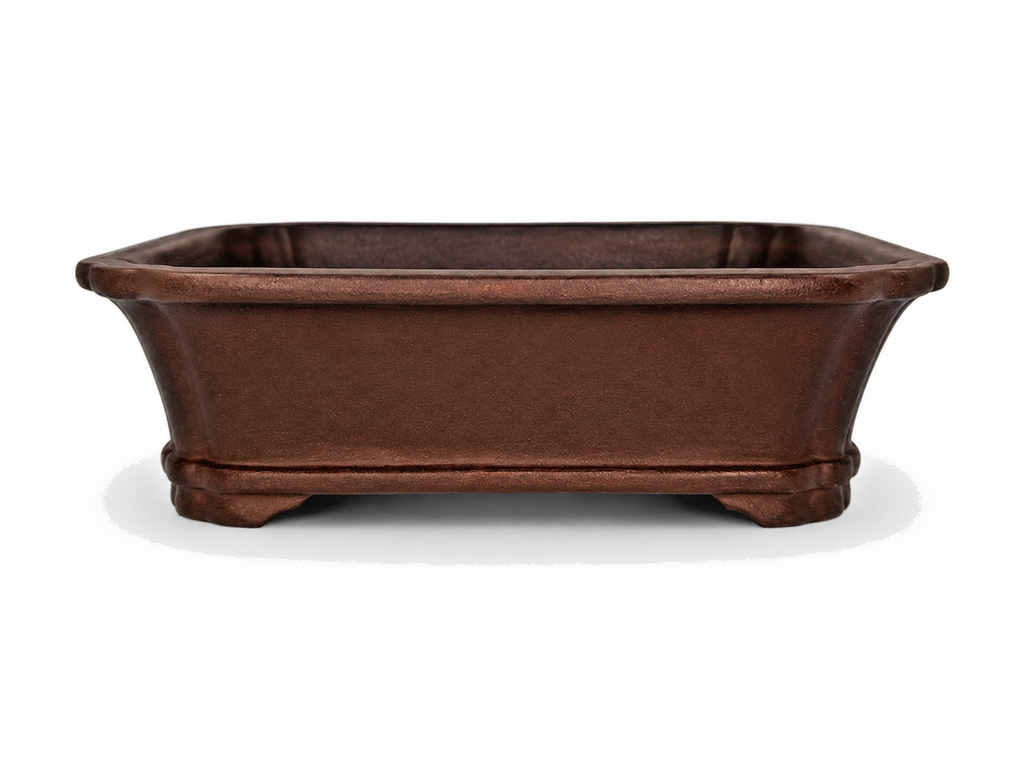 Brown rectangular bonsai pot with flared rim, tapered walls and shaped feet